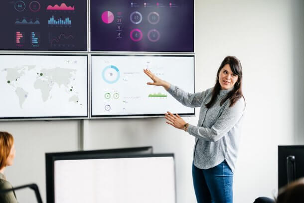 woman presenting marketing report on big screen