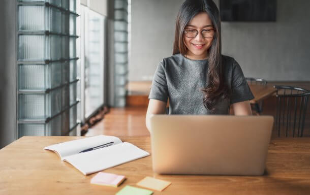 Back-to-school marketing: Marketer sitting in front of a laptop
