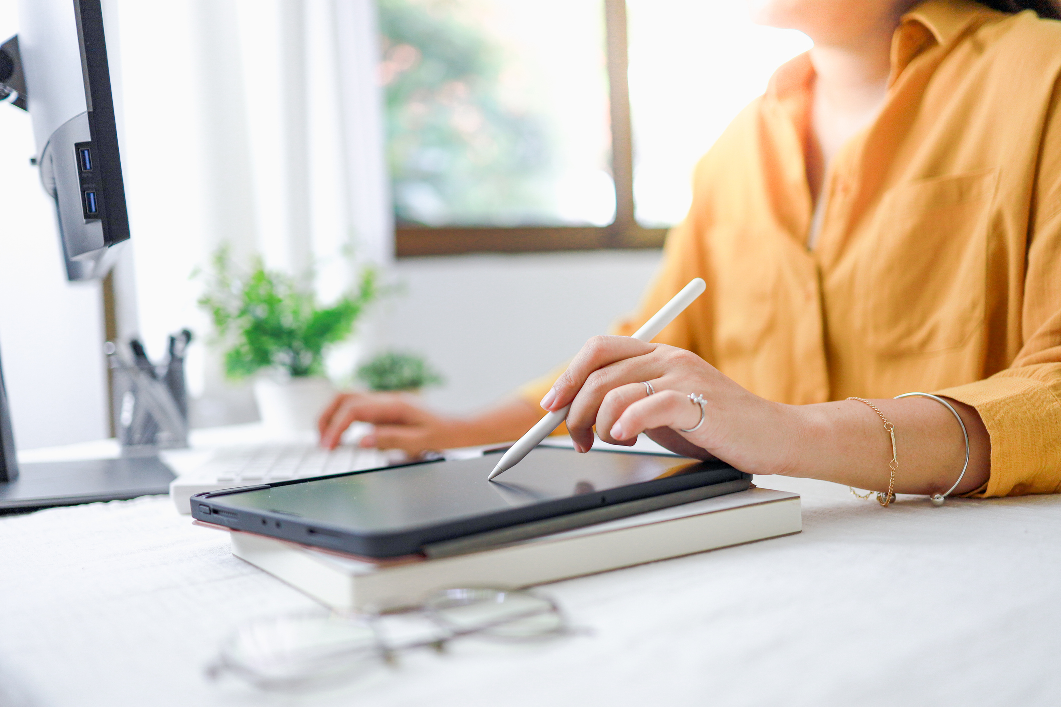 Midsection Of Man Using Graphic Tablet While Sitting On Table At Home ...