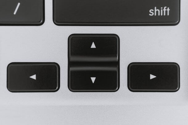 A picture close up of computer keyboard arrow keys.